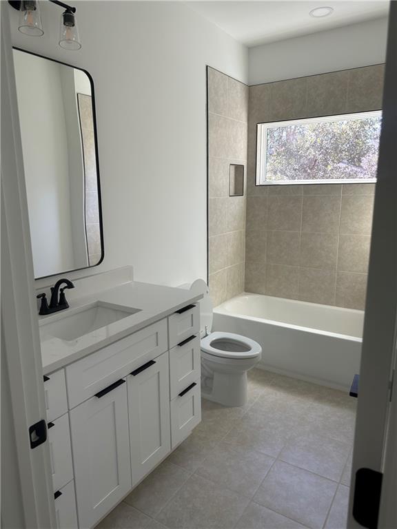 Undisclosed Address Atlanta, GA 30310 - Photo 11 of 25 a bathroom with a granite countertop sink a toilet and a bathtub