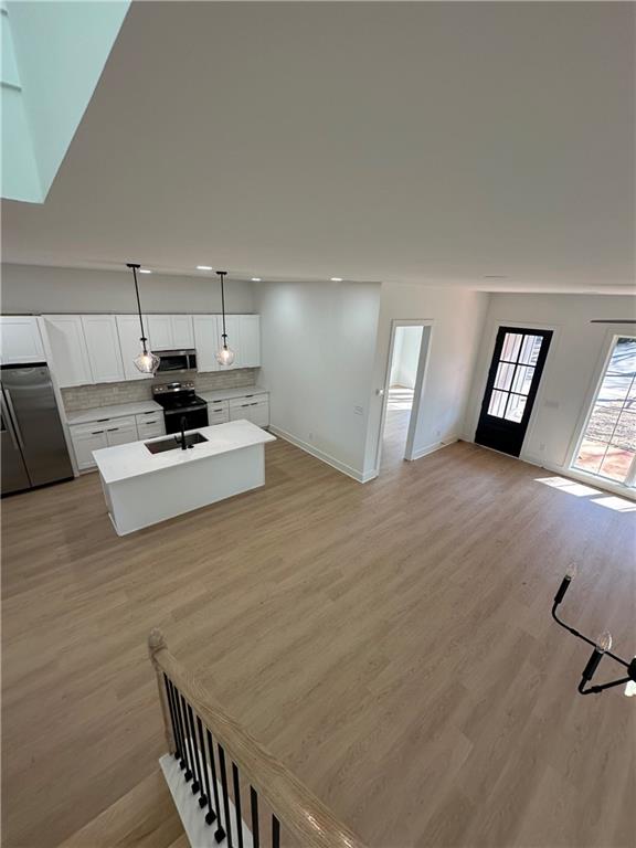 Undisclosed Address Atlanta, GA 30310 - Photo 14 of 25 a living room with furniture and a wooden floor