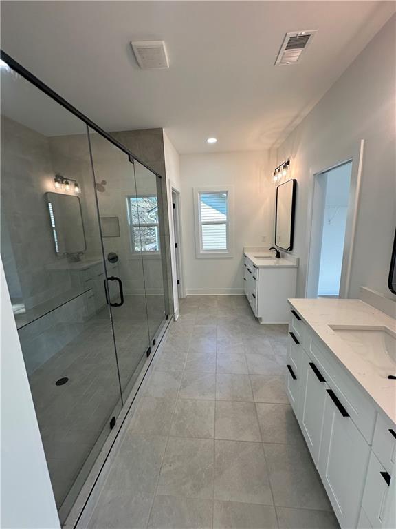Undisclosed Address Atlanta, GA 30310 - Photo 19 of 25 a spacious bathroom with a granite countertop sink a mirror and shower