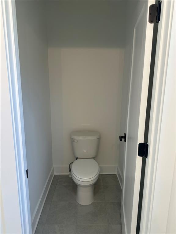 Undisclosed Address Atlanta, GA 30310 - Photo 22 of 25 a white toilet sitting next to a small window