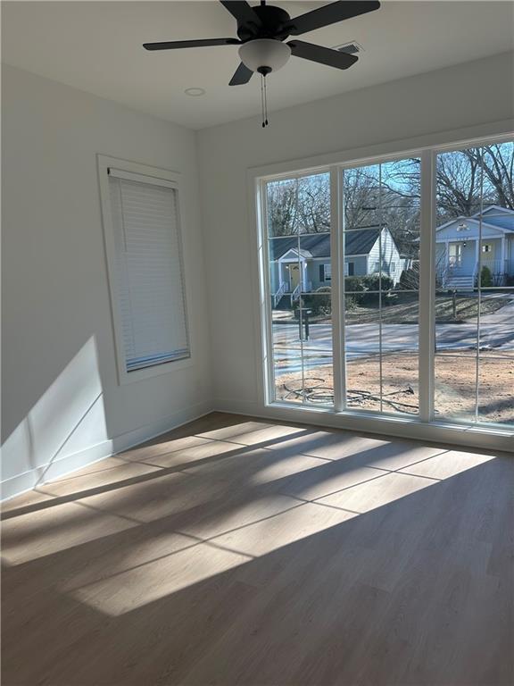 Undisclosed Address Atlanta, GA 30310 - Photo 9 of 25 a view of a livingroom with a ceiling fan and window