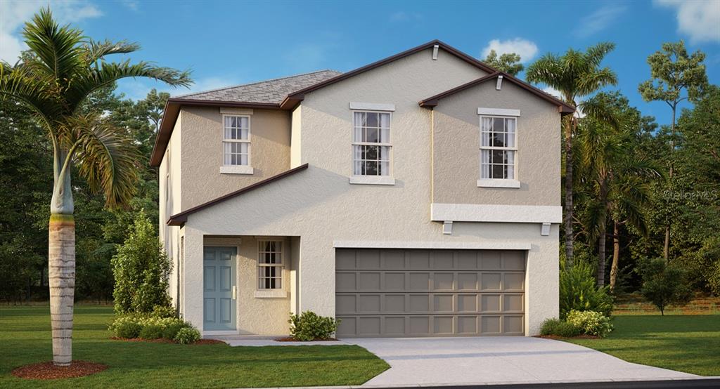 a front view of a house with a yard and garage
