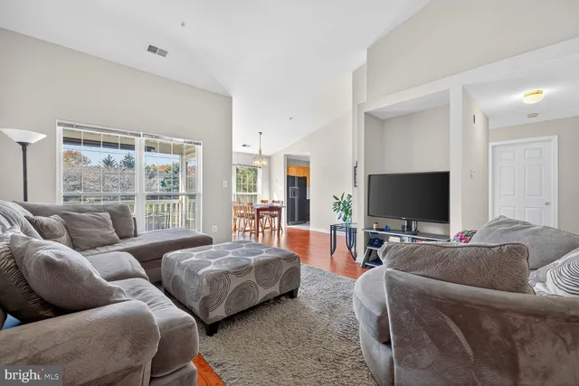 a bedroom with bed and a flat screen tv