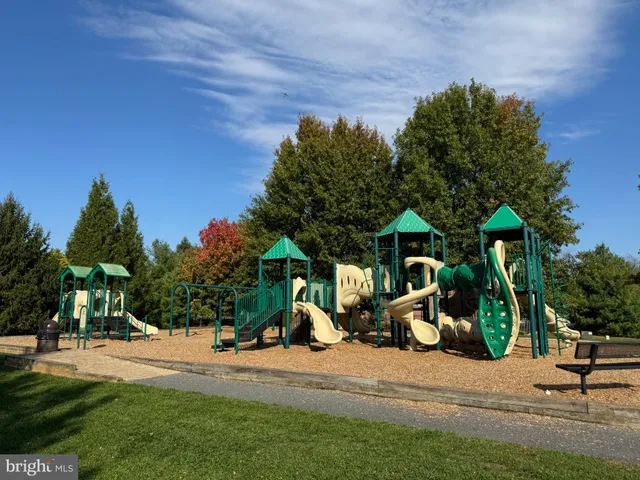 a view of a park with swings and slides