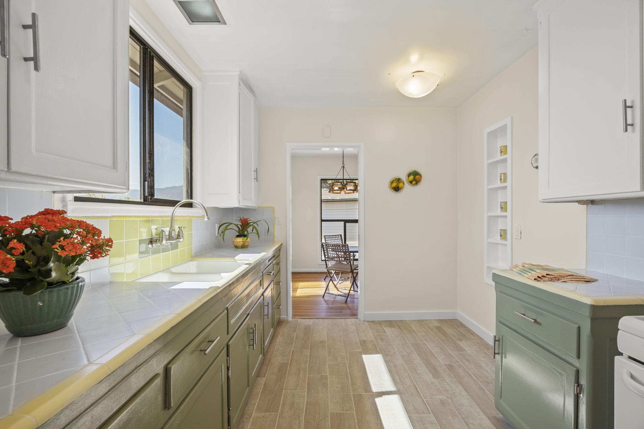 155 South Ontare Road Santa Barbara, CA 93105 - Photo 16 of 45 a kitchen with granite countertop a sink stainless steel appliances and cabinets