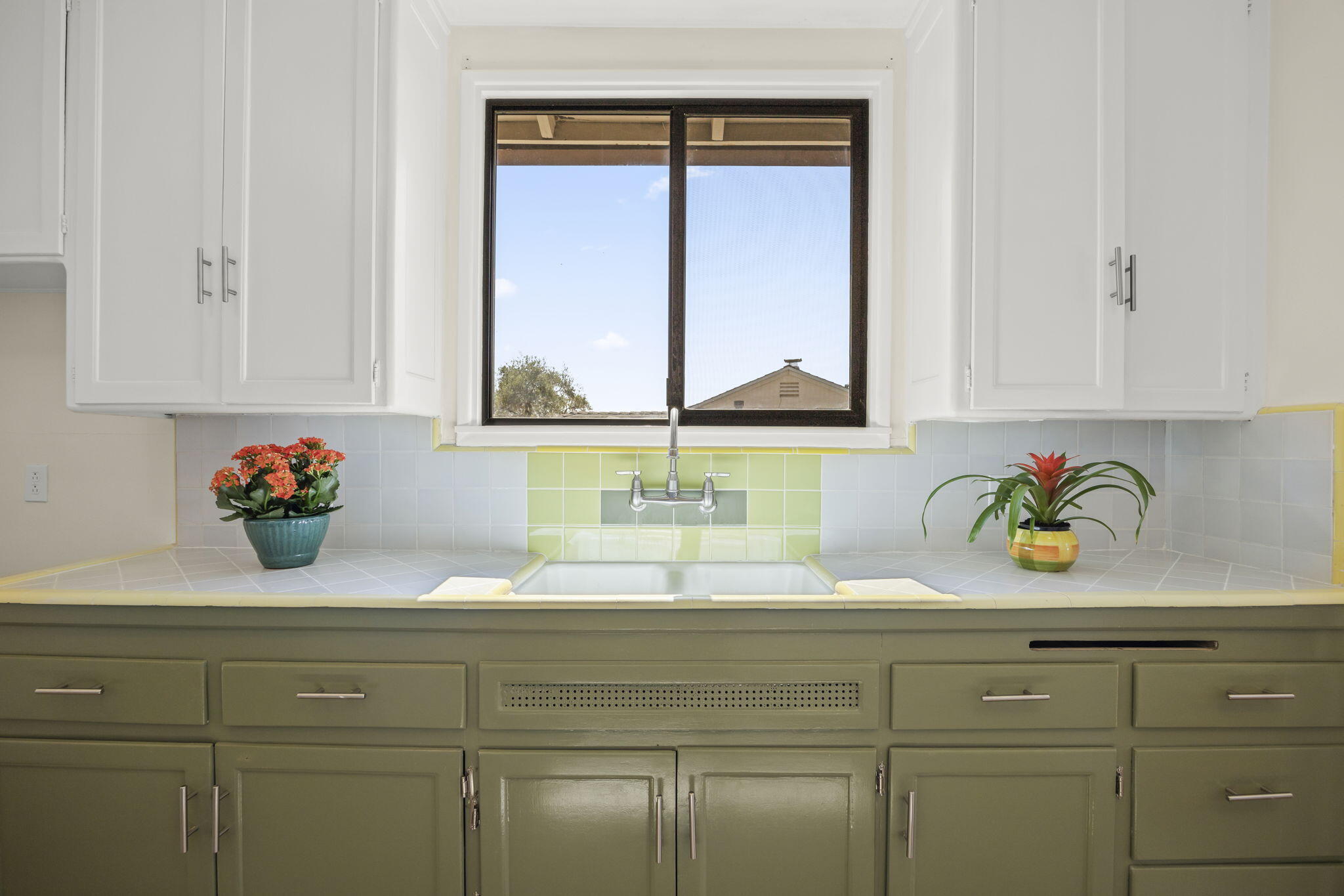 155 South Ontare Road Santa Barbara, CA 93105 - Photo 17 of 45 a bathroom with a granite countertop sink and a window