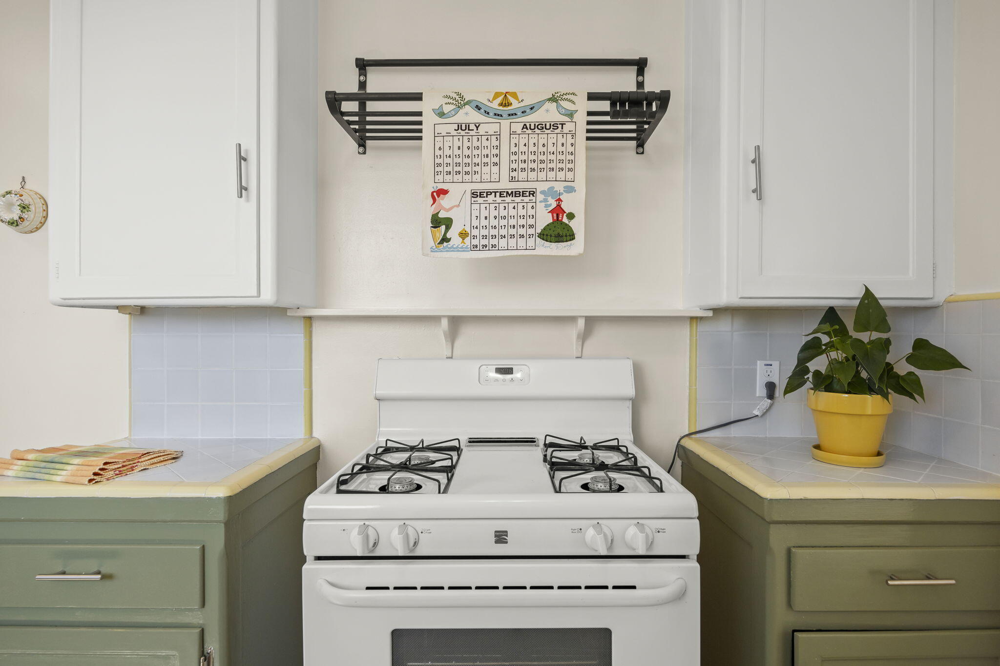 155 South Ontare Road Santa Barbara, CA 93105 - Photo 18 of 45 a kitchen with a stove and a white cabinets