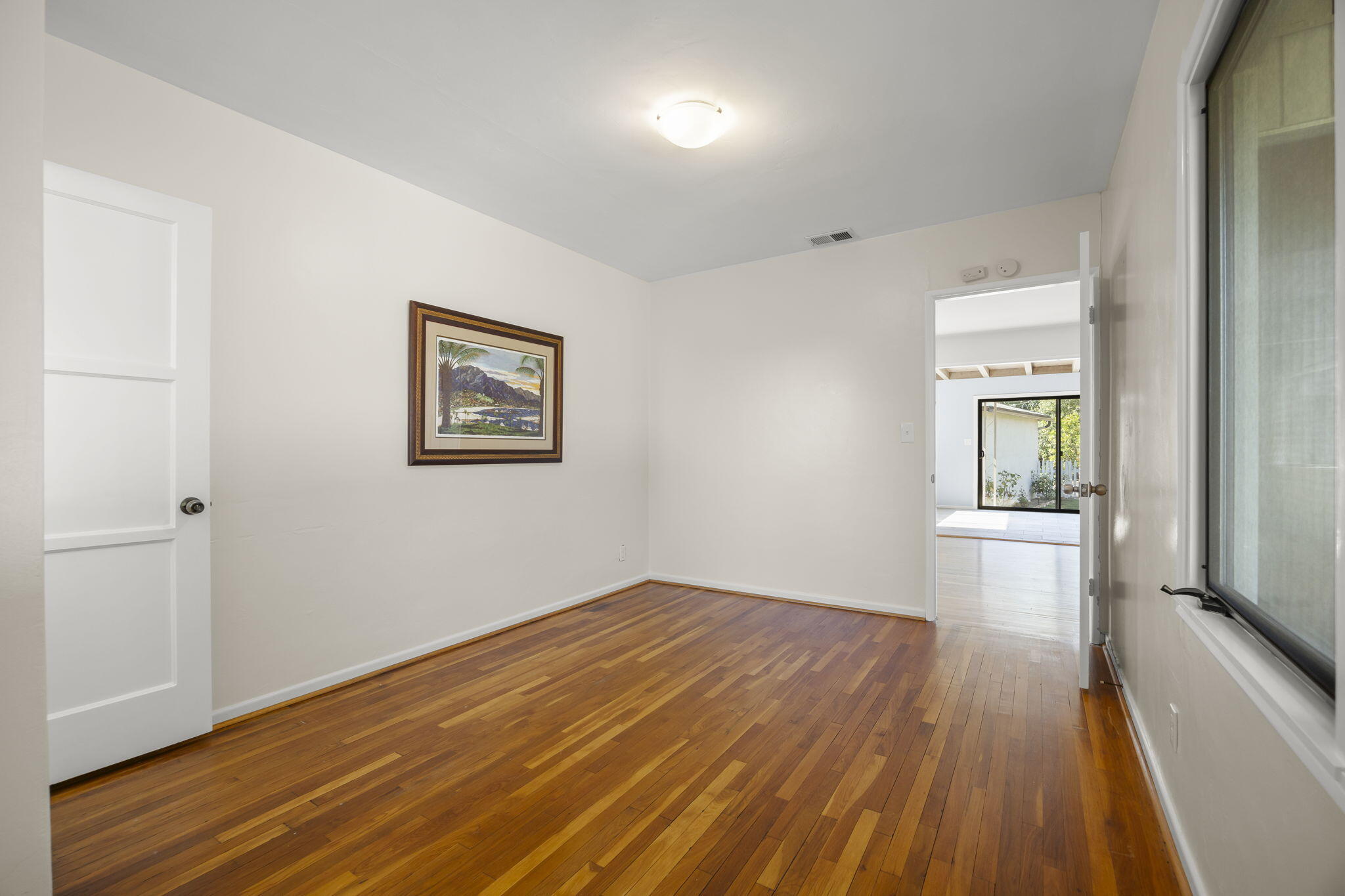 155 South Ontare Road Santa Barbara, CA 93105 - Photo 21 of 45 a view of empty room with wooden floor and fan