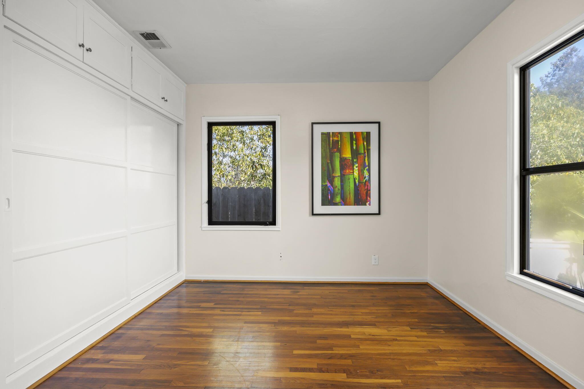 155 South Ontare Road Santa Barbara, CA 93105 - Photo 22 of 45 a view of an empty room with window and wooden floor