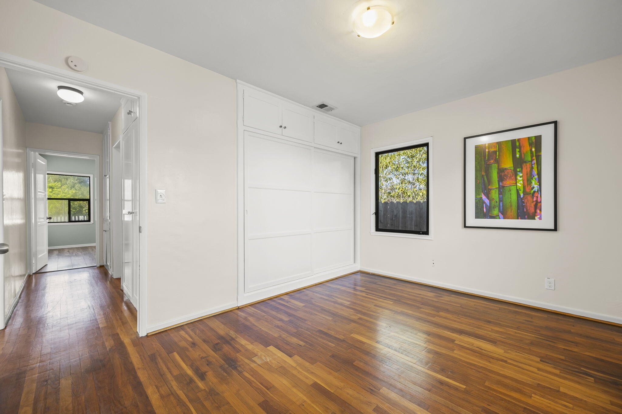 155 South Ontare Road Santa Barbara, CA 93105 - Photo 25 of 45 an empty room with wooden floor and windows