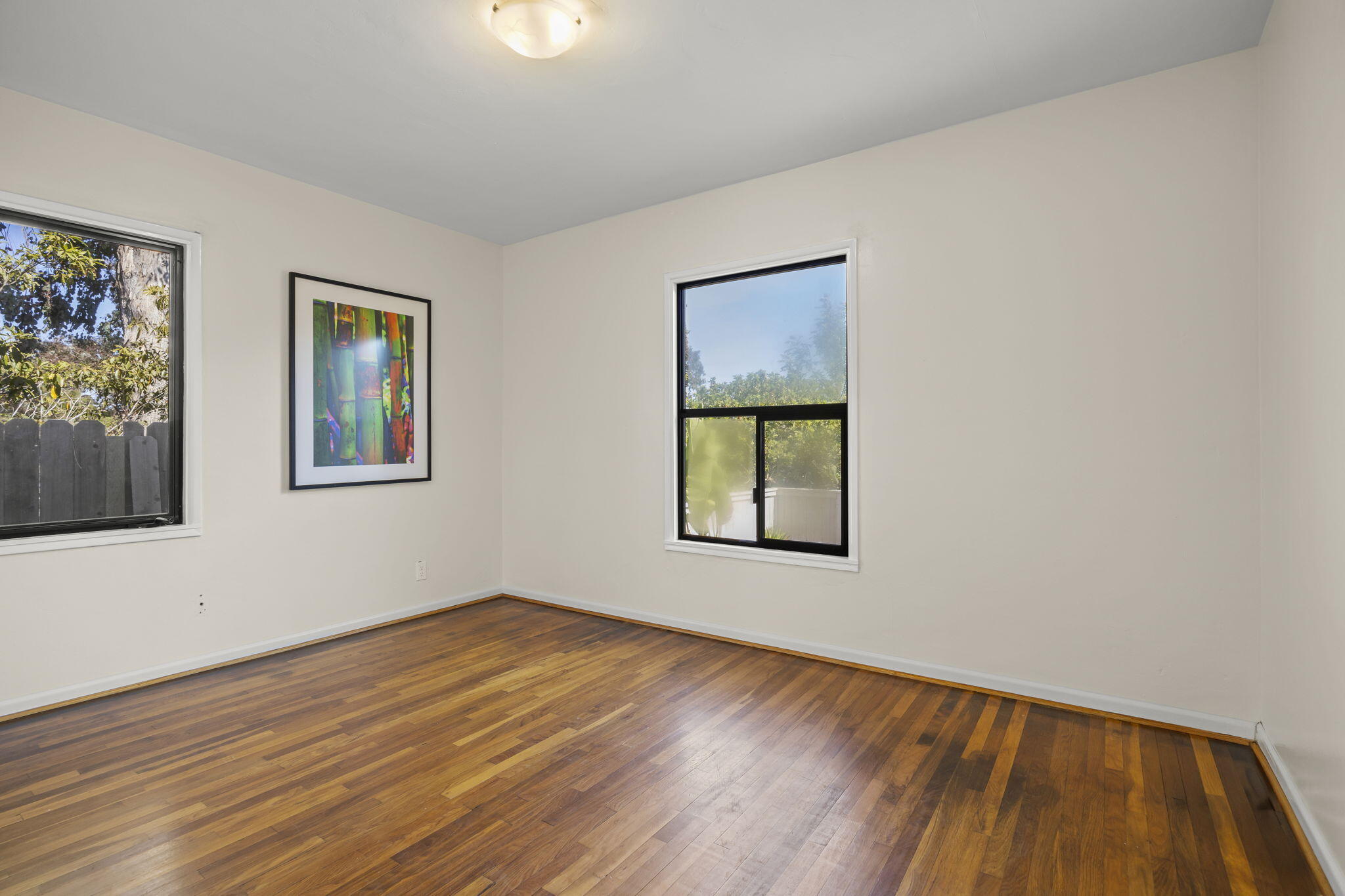 155 South Ontare Road Santa Barbara, CA 93105 - Photo 26 of 45 a view of an empty room with window and wooden floor