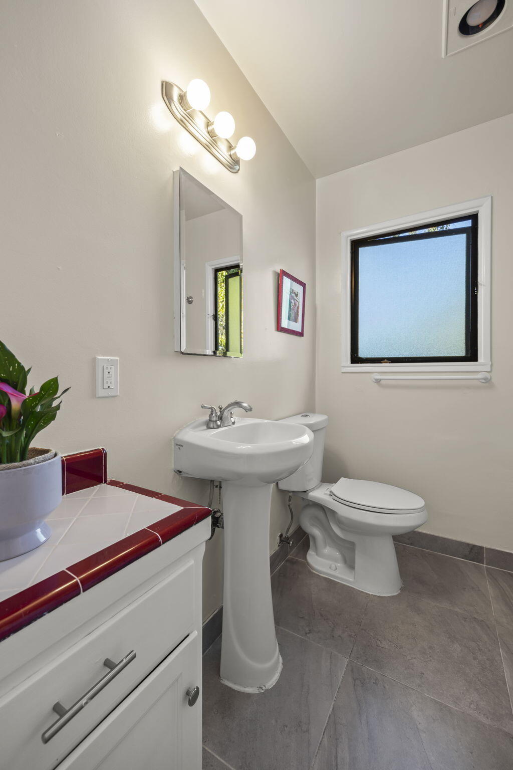 155 South Ontare Road Santa Barbara, CA 93105 - Photo 27 of 45 a bathroom with a toilet sink and mirror