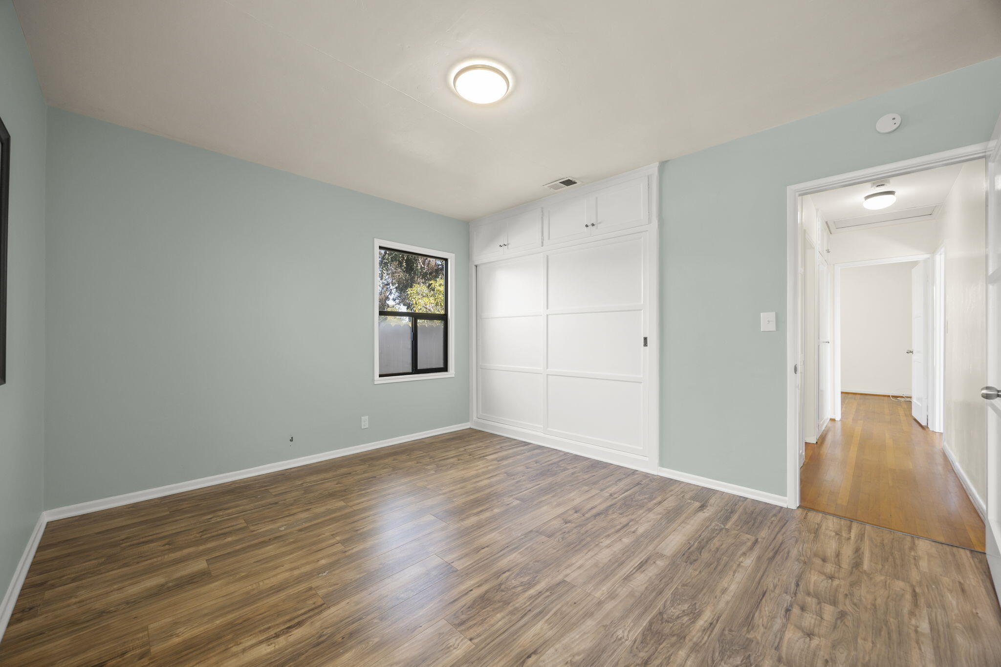 155 South Ontare Road Santa Barbara, CA 93105 - Photo 30 of 45 wooden floor in an empty room with a window