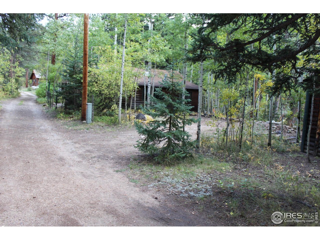 223 Riverside Drive Lyons, CO 80540 - Photo 11 of 33 Private road turn off to subject property and just 3 homes past that are seasonal