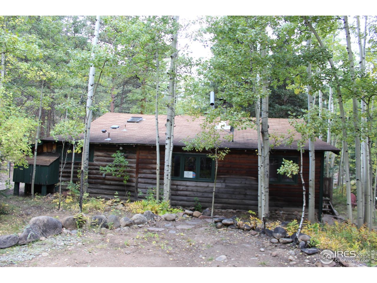 223 Riverside Drive Lyons, CO 80540 - Photo 18 of 33 East side of Cabin with parking