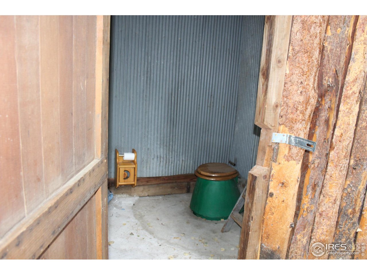 223 Riverside Drive Lyons, CO 80540 - Photo 32 of 33 Out house with 500 gallon vault