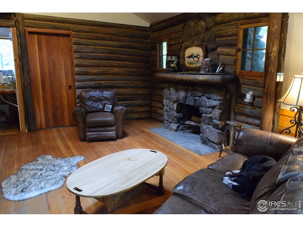223 Riverside Drive Lyons, CO 80540 - Photo 5 of 33 Living room fireplace
