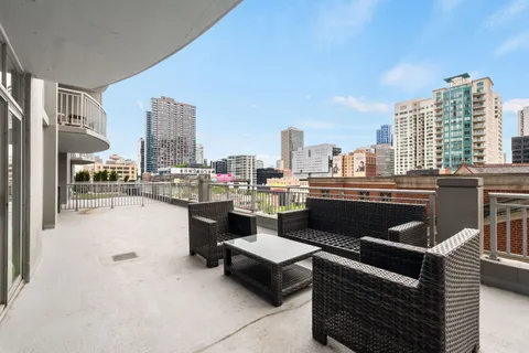 a couch sitting in a middle of a city