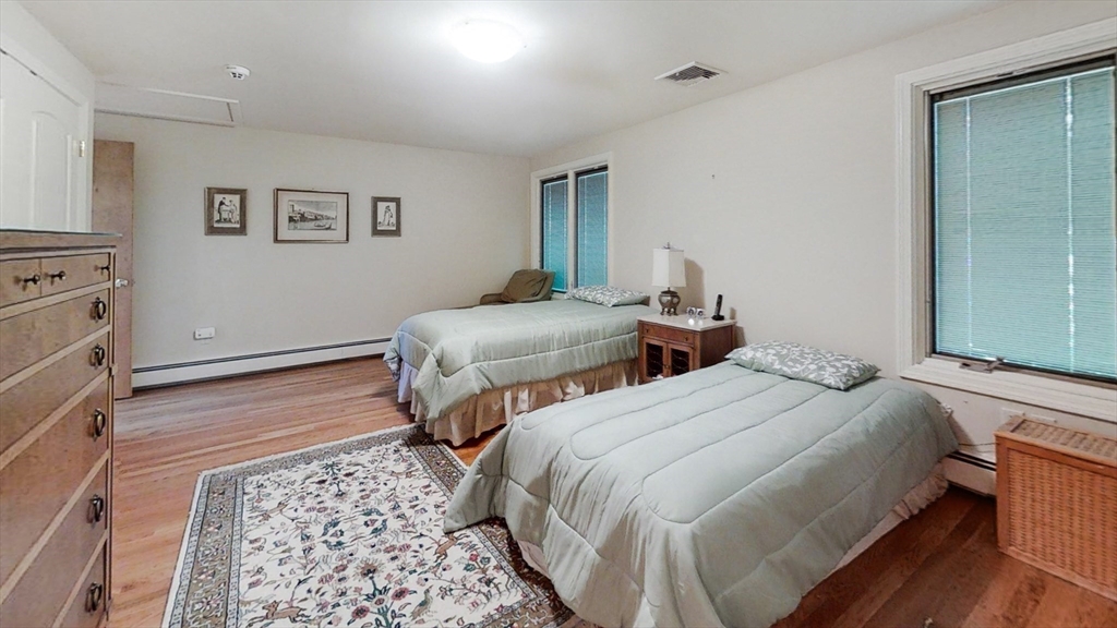 30 Tyler Road Lexington, MA 02420 - Photo 16 of 40 a bedroom with two beds and painting on the wall