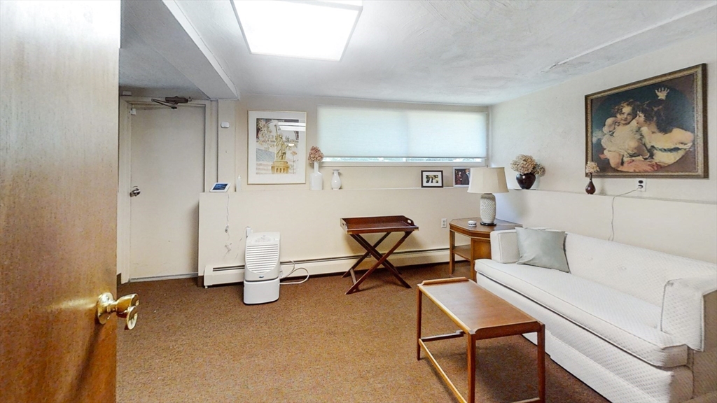 30 Tyler Road Lexington, MA 02420 - Photo 26 of 40 a living room with furniture a air conditioner vent and a window