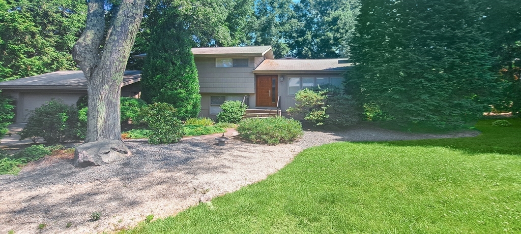 30 Tyler Road Lexington, MA 02420 - Photo 3 of 40 a view of a house with yard and a garden