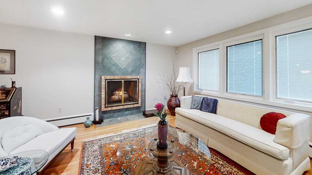 30 Tyler Road Lexington, MA 02420 - Photo 4 of 40 a living room with furniture and a fireplace