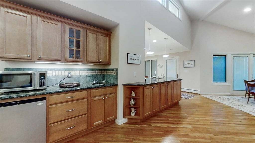 30 Tyler Road Lexington, MA 02420 - Photo 6 of 40 a kitchen with stainless steel appliances granite countertop a stove a sink and a microwave