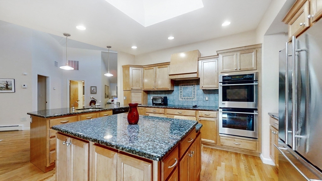 30 Tyler Road Lexington, MA 02420 - Photo 7 of 40 a kitchen with stainless steel appliances granite countertop a sink refrigerator and microwave