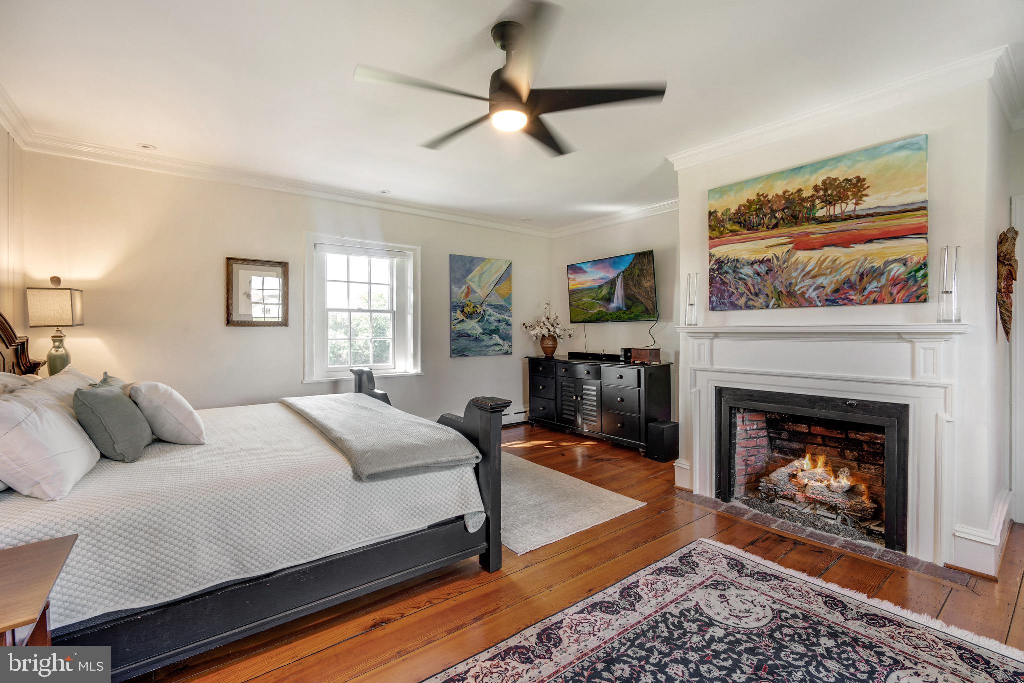 6029 Edesville Road Rock Hall, MD 21661 - Photo 13 of 75 Primary bedroom--gas fireplace and original floors