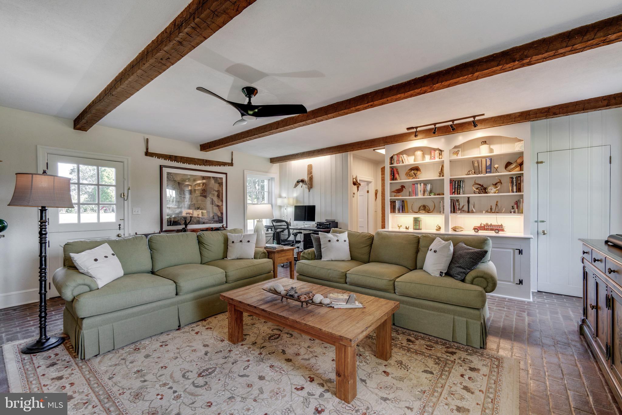 6029 Edesville Road Rock Hall, MD 21661 - Photo 27 of 75 Den with built-in cabinetry, brick floors