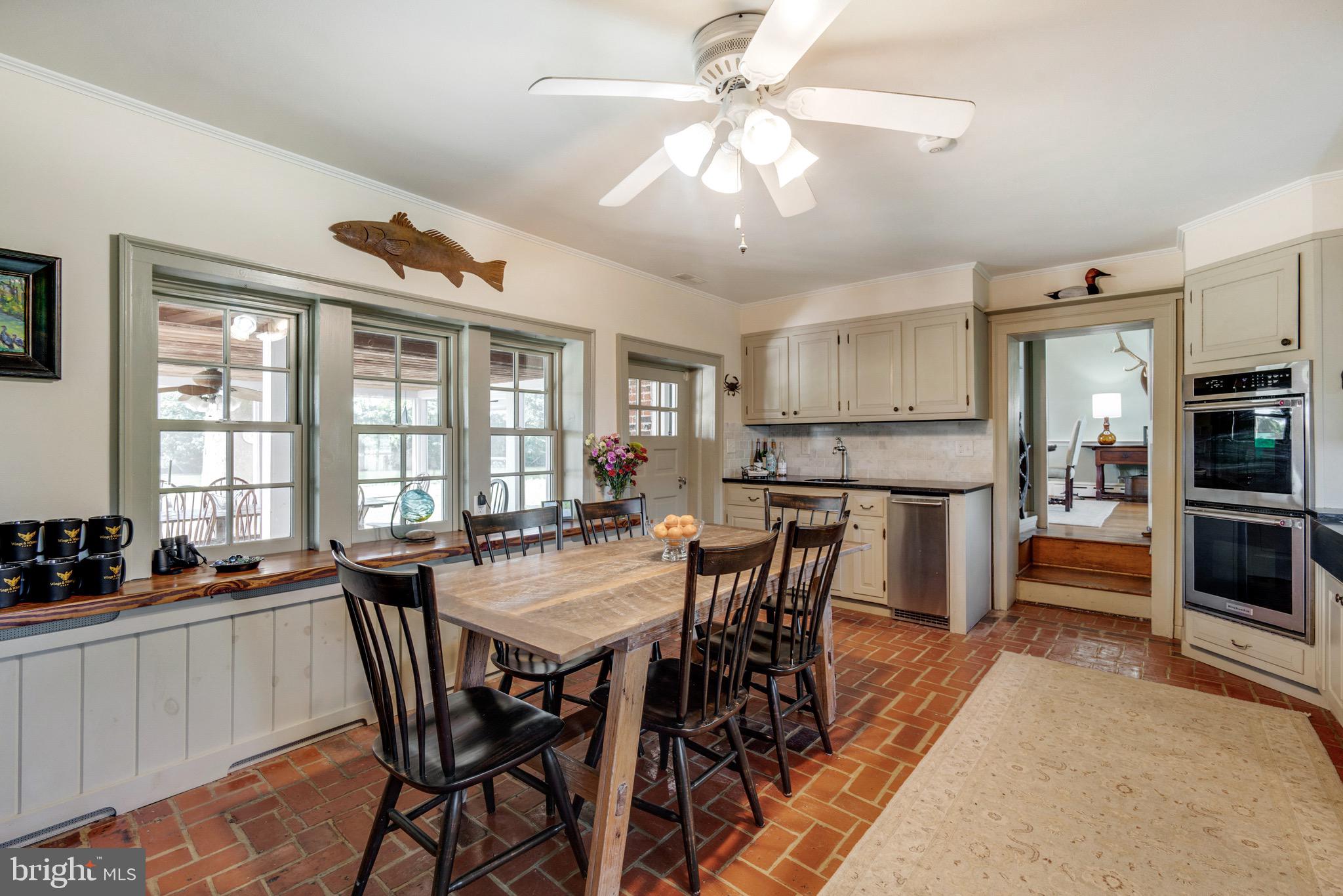 6029 Edesville Road Rock Hall, MD 21661 - Photo 30 of 75 Kitchen with bar area and access to porch