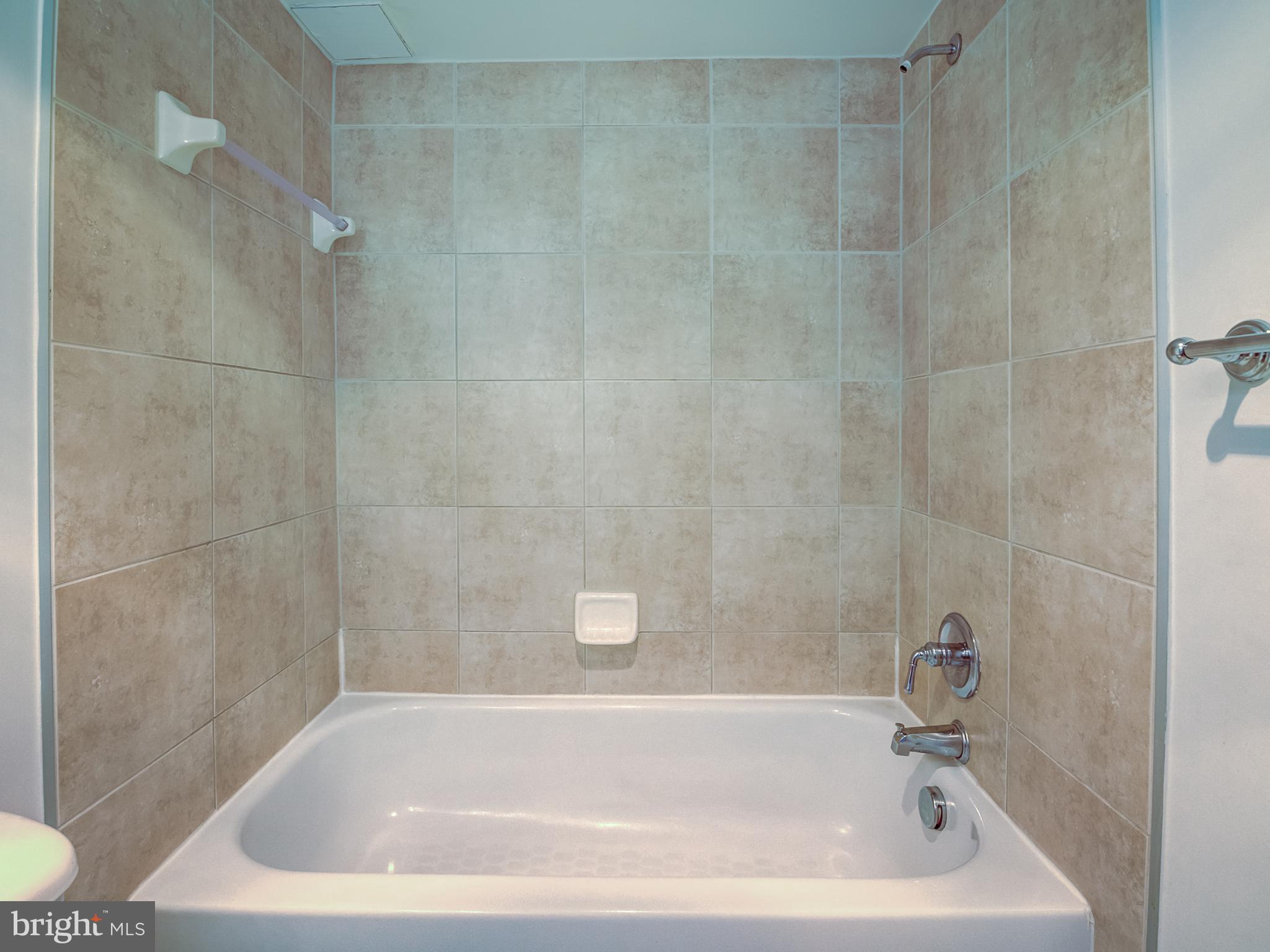 1220 Blair Mill Road, Unit 902 Silver Spring, MD 20910 - Photo 35 of 48 a bathroom with a tub