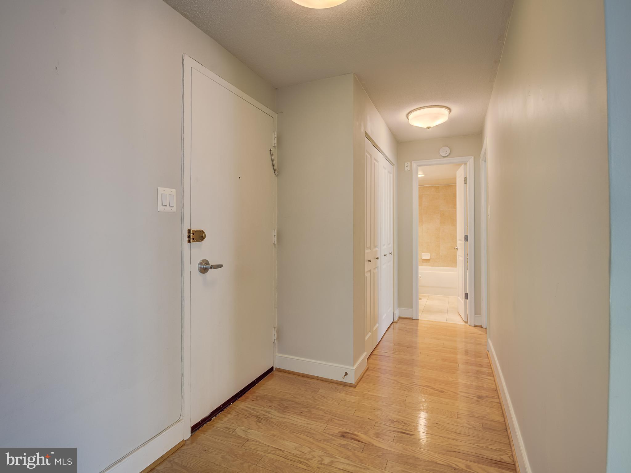 1220 Blair Mill Road, Unit 902 Silver Spring, MD 20910 - Photo 4 of 48 a view of a hallway with wooden floor