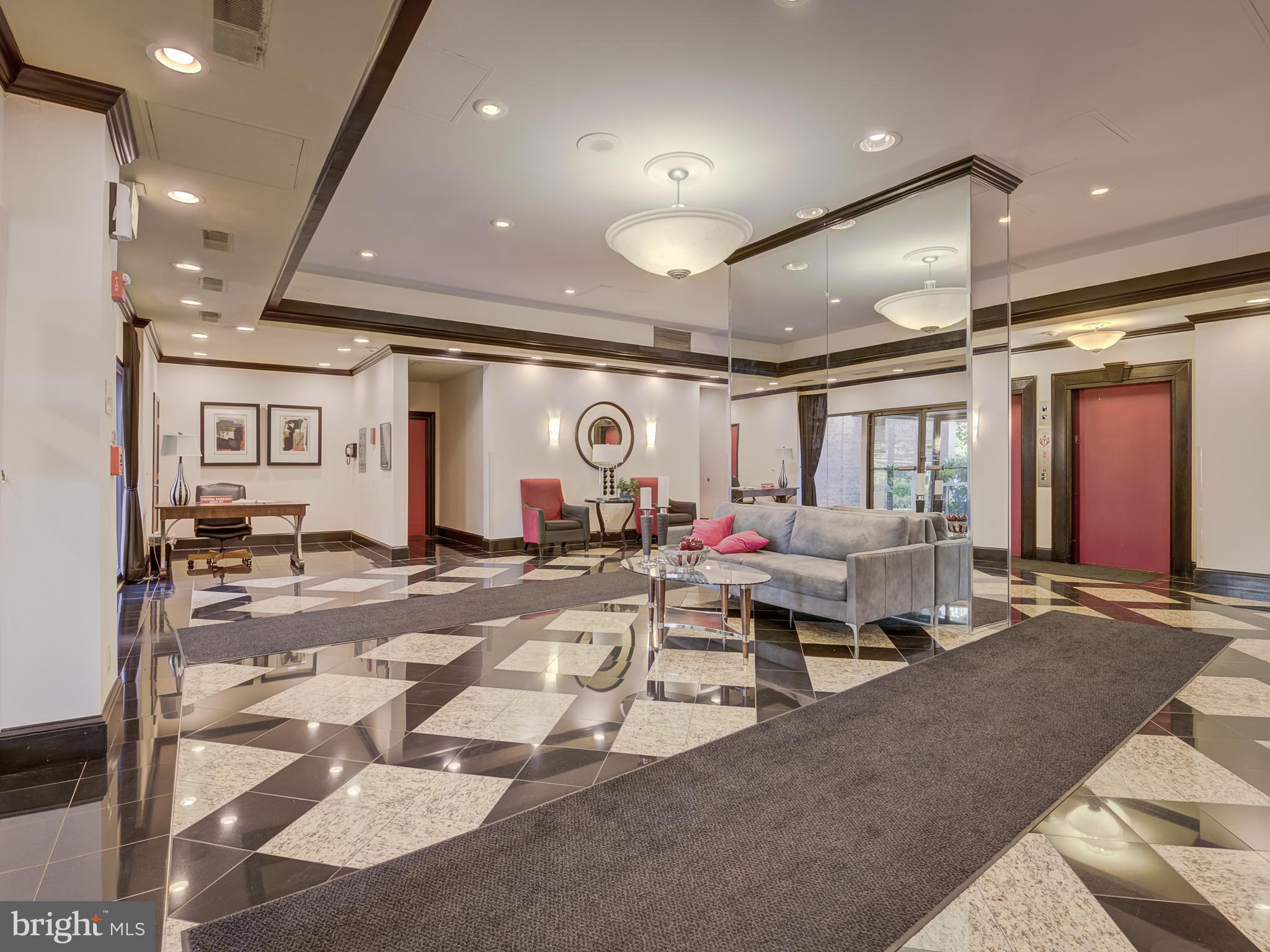 1220 Blair Mill Road, Unit 902 Silver Spring, MD 20910 - Photo 43 of 48 a living room with lots of furniture and a ceiling fan