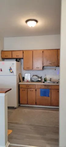 a kitchen with stainless steel appliances granite countertop a sink and cabinets