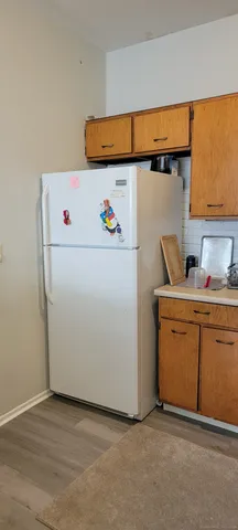 a kitchen with stainless steel appliances kitchen island granite countertop a sink and cabinets