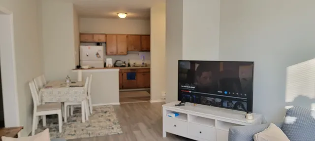 a view of front door with wooden floor