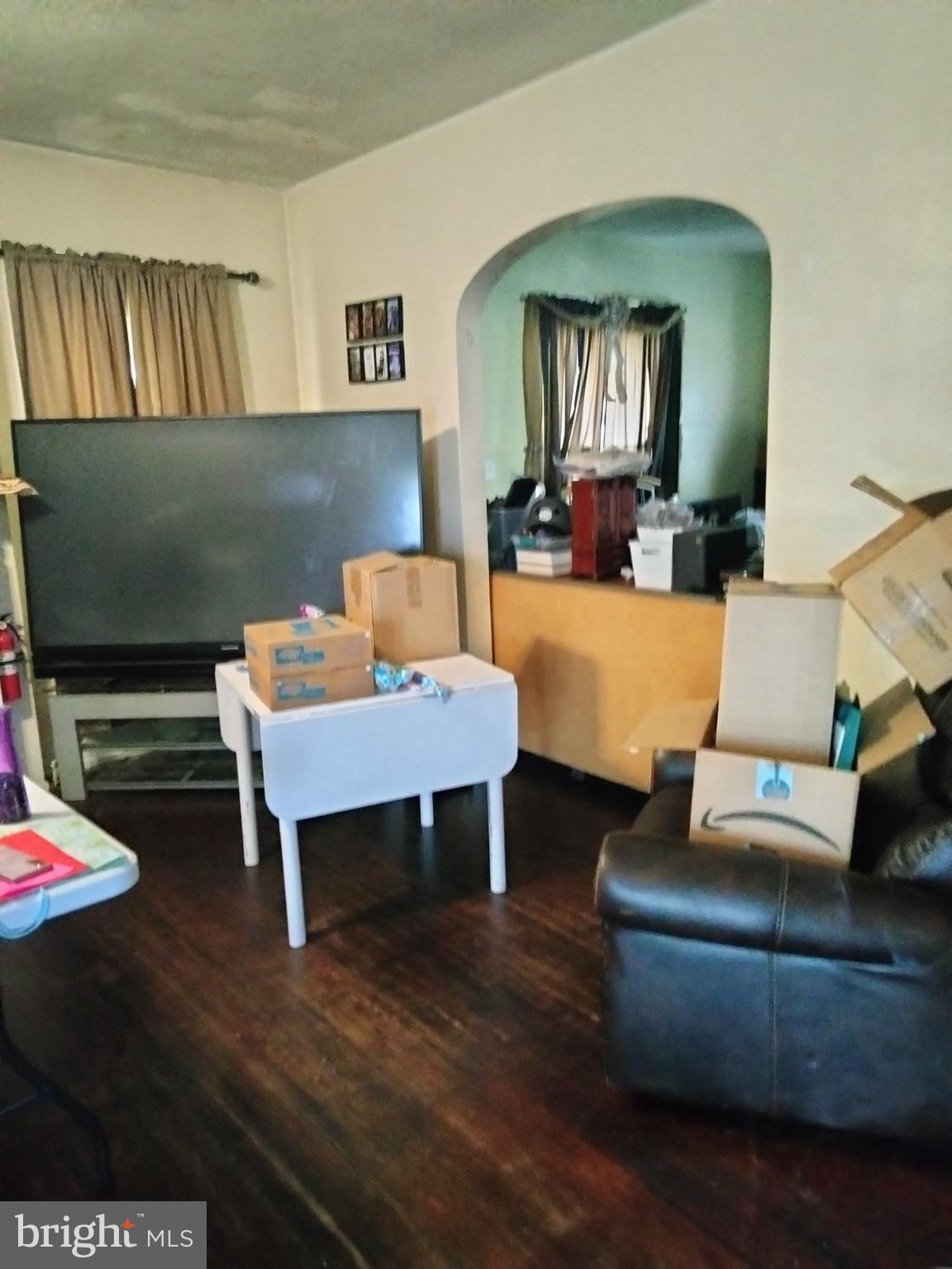 7411 Main Street Willards, MD 21874 - Photo 19 of 43 a living room with furniture and a wooden floor