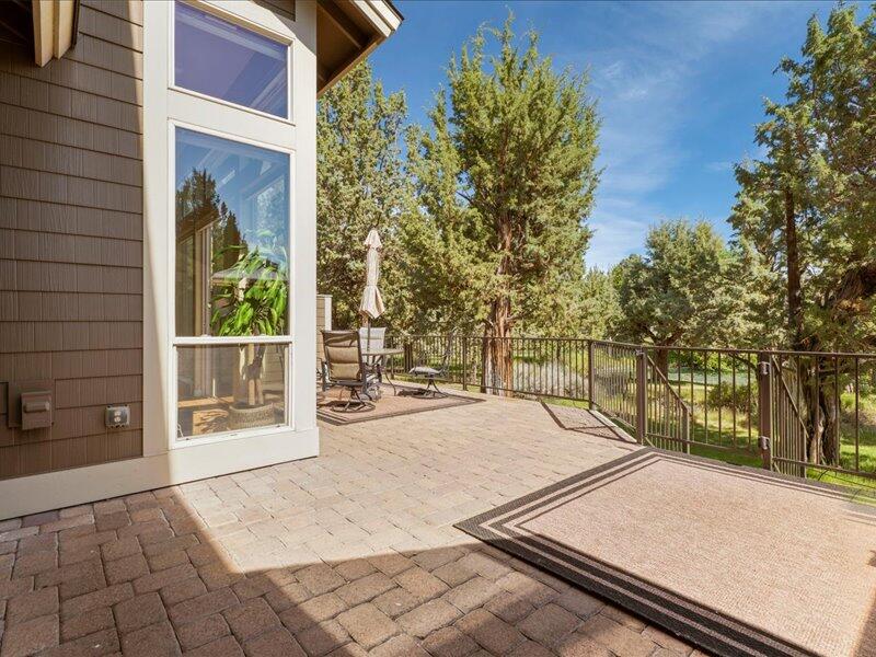 1378 Highland View Loop Redmond, OR 97756 - Photo 9 of 98 a view of backyard with large trees and wooden fence