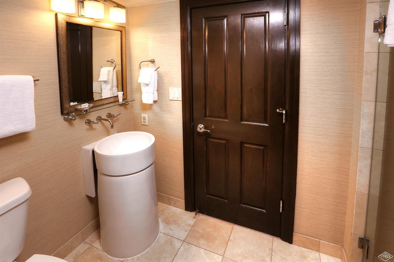 210 Offerson Road, Unit 40828 Beaver Creek, CO 81620 - Photo 10 of 16 a bathroom with a sink and a mirror