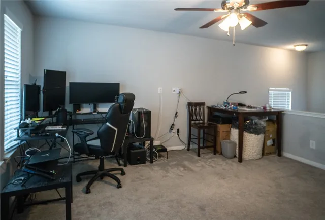 a view of a workspace with furniture