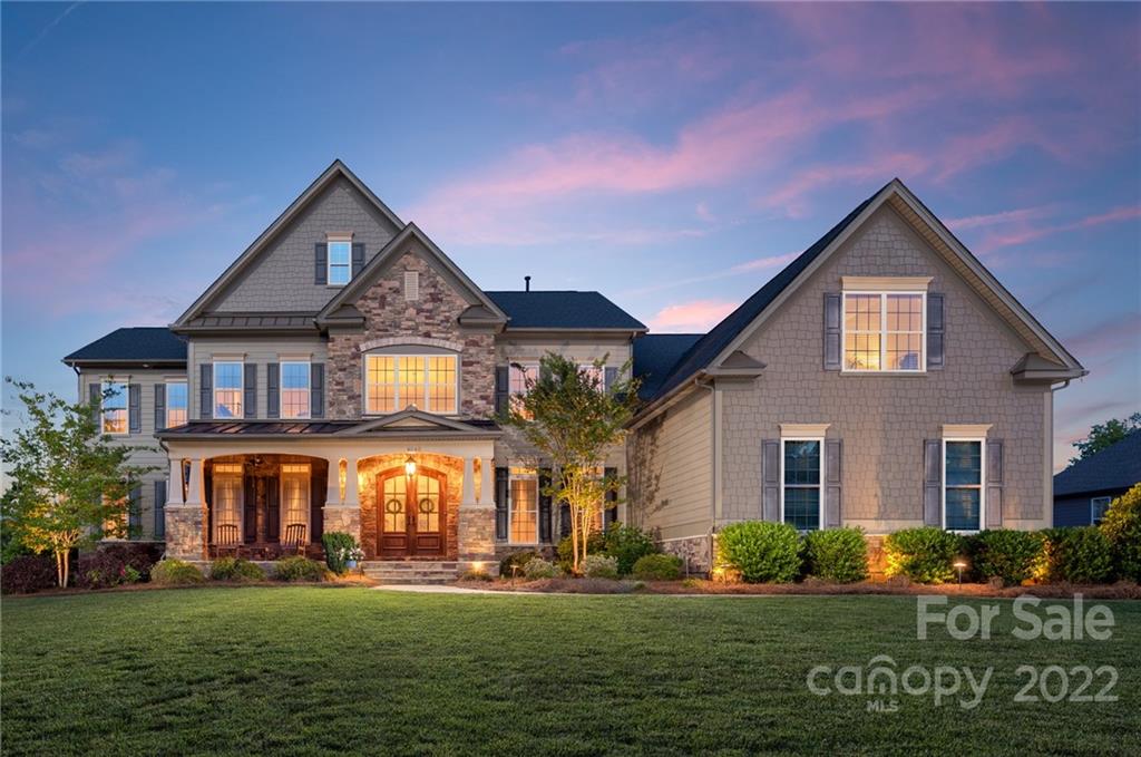 4040 Flowering Peach Road Marvin, NC 28173 - Photo 1 of 38 a front view of a house with a yard