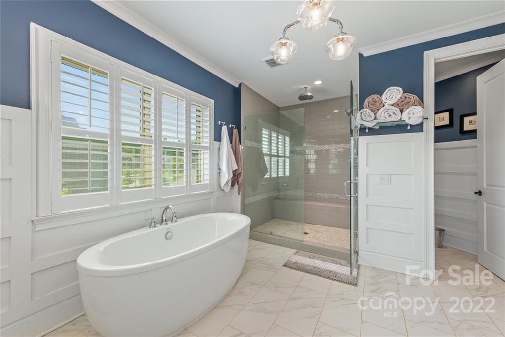 4040 Flowering Peach Road Marvin, NC 28173 - Photo 15 of 38 a bathroom with a bathtub and a shower