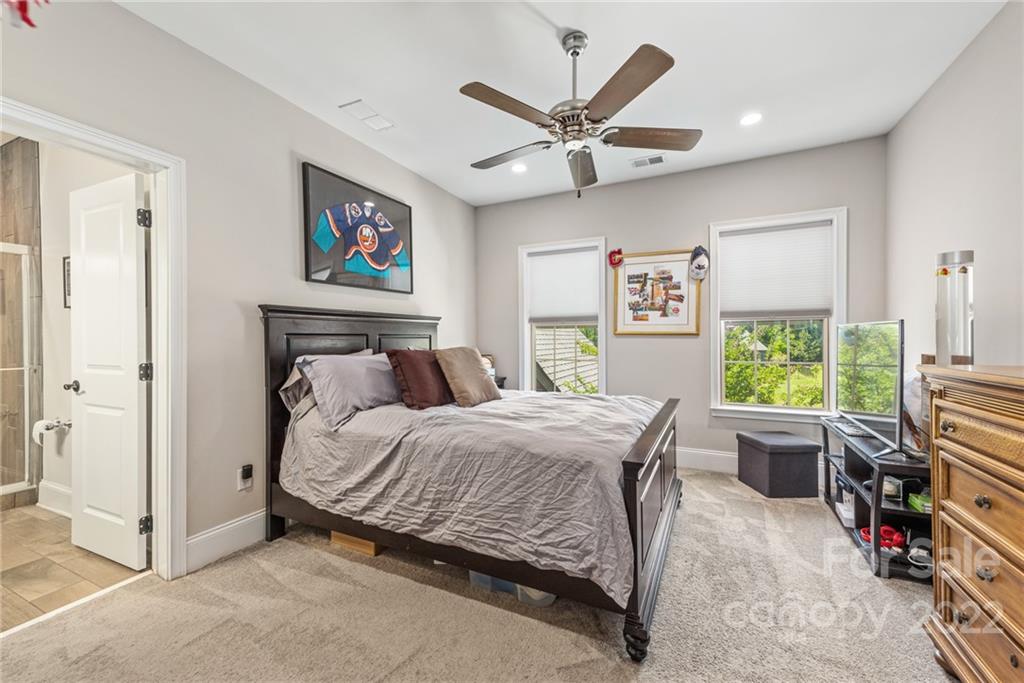 4040 Flowering Peach Road Marvin, NC 28173 - Photo 23 of 38 a bedroom with a bed a computer on a desk and chair