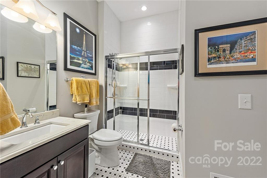4040 Flowering Peach Road Marvin, NC 28173 - Photo 28 of 38 a bathroom with a sink toilet and shower