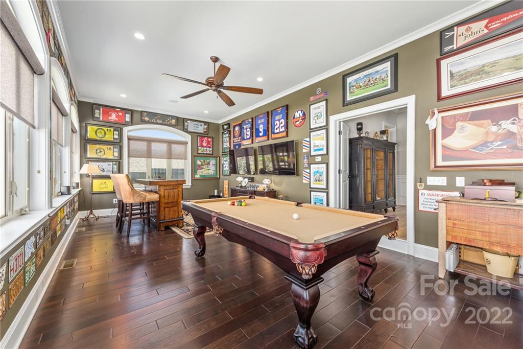 4040 Flowering Peach Road Marvin, NC 28173 - Photo 30 of 38 a room with stainless steel appliances lots of wooden furniture and large windows