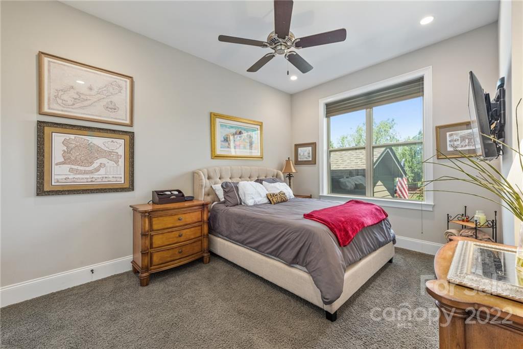 4040 Flowering Peach Road Marvin, NC 28173 - Photo 31 of 38 a bed room with a bed and a tv