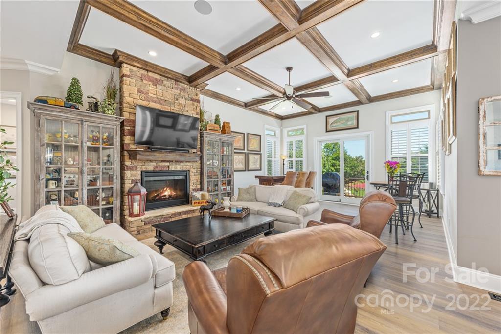 4040 Flowering Peach Road Marvin, NC 28173 - Photo 32 of 38 a living room with fireplace furniture and a flat screen tv