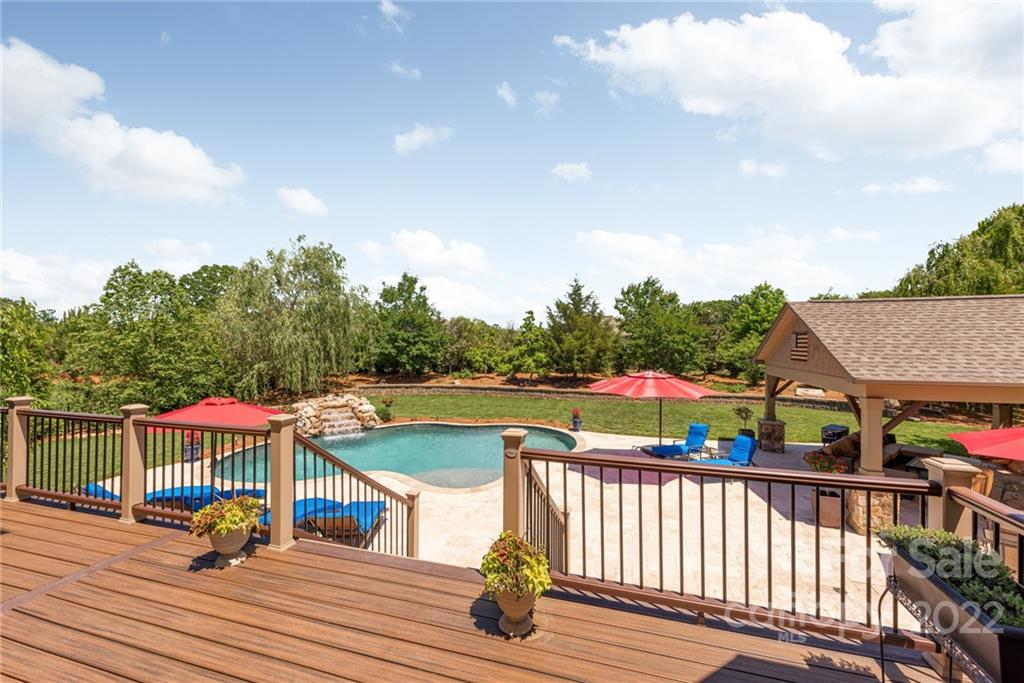 4040 Flowering Peach Road Marvin, NC 28173 - Photo 4 of 38 a view of a deck with chairs and wooden floor