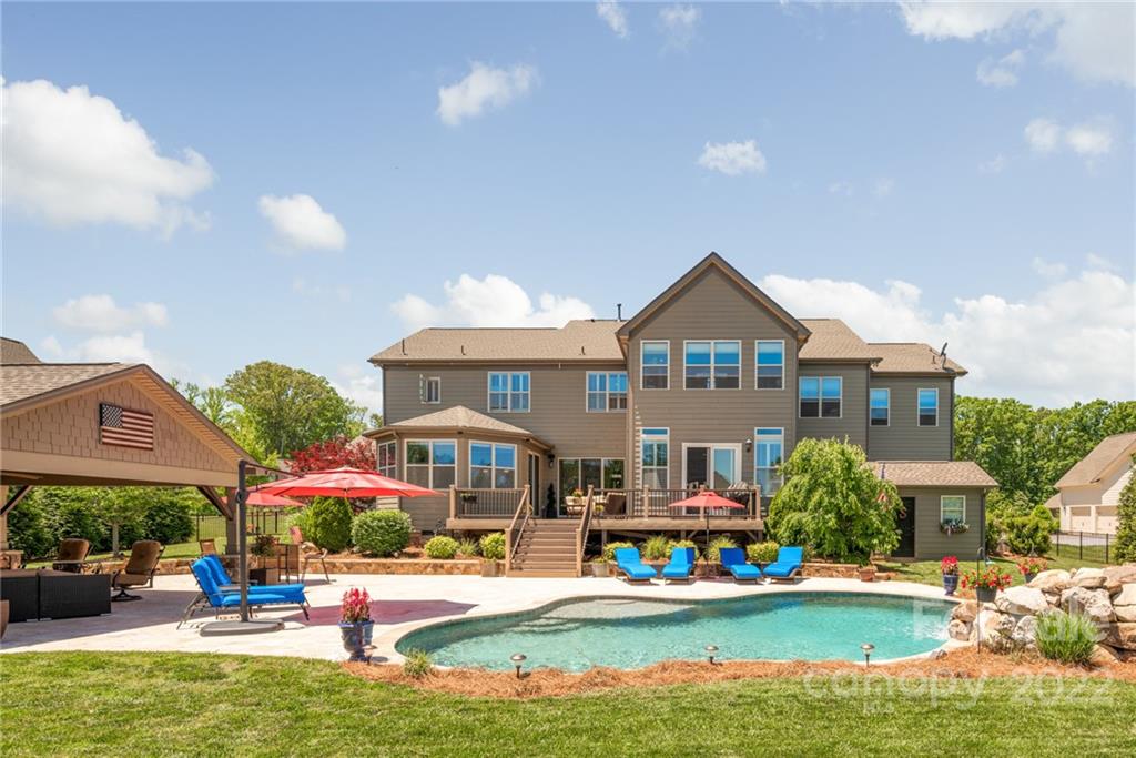 4040 Flowering Peach Road Marvin, NC 28173 - Photo 7 of 38 a front view of houses with yard swimming pool and green space